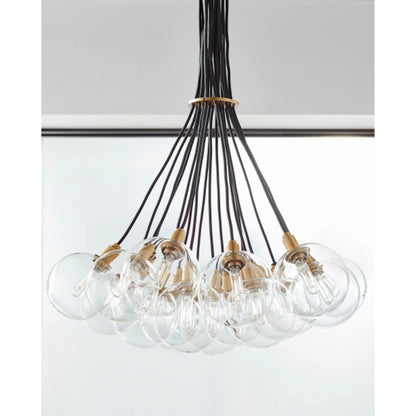 Gambit Multi-Port Chandelier by Tech Lighting in aged brass. Made from glass in a modern style.