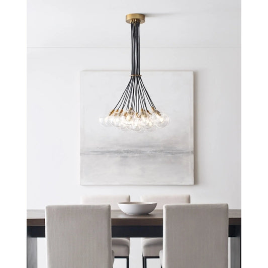 Gambit Multi-Port Chandelier by Tech Lighting in aged brass. Made from glass in a modern style.