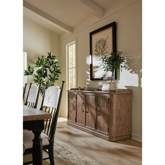 Americana Four-Door Buffet by Hooker Furniture in brown and honey finish. Made from oak veneers with solid-wood edge top in a rustic style.