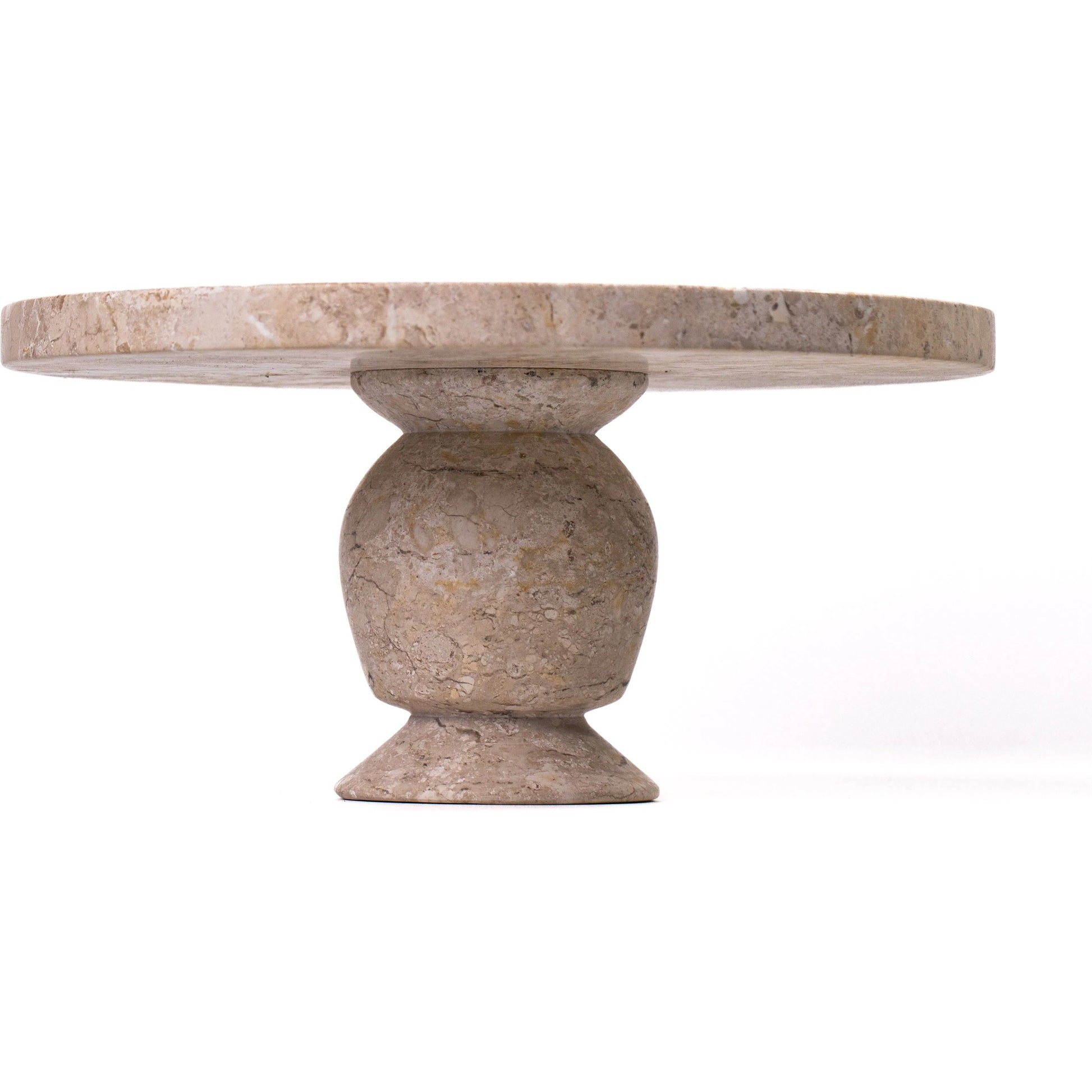 Natural Cake Stand by TOV Furniture in travertine. Made from travertine in a unique style.