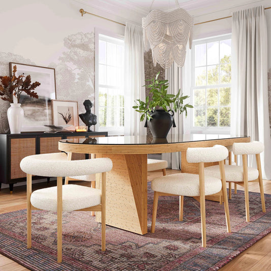 Caren Rattan and Glass Oval Dining Table by TOV Furniture in natural. Made from glass, mahogany, plywood, rattan in a modern style.
