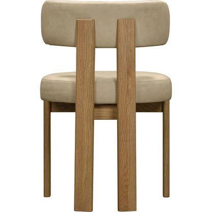 Odessa Vegan Leather Dining Chair by TOV Furniture. Made from faux leather, wood in a transitional style.