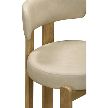 Odessa Vegan Leather Dining Chair by TOV Furniture. Made from faux leather, wood in a transitional style.