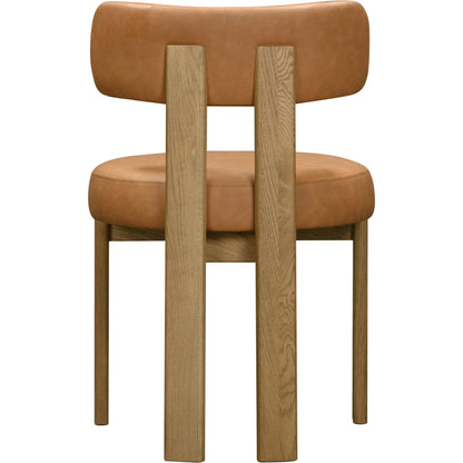 Odessa Vegan Leather Dining Chair by TOV Furniture. Made from faux leather, wood in a transitional style.