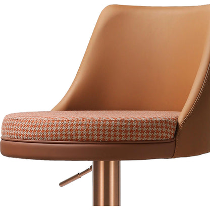 Reagan Houndstooth Adjustable Swivel Stool by TOV Furniture in cafe au lait. Made from fabric, stainless steel, vegan leather in a modern style.