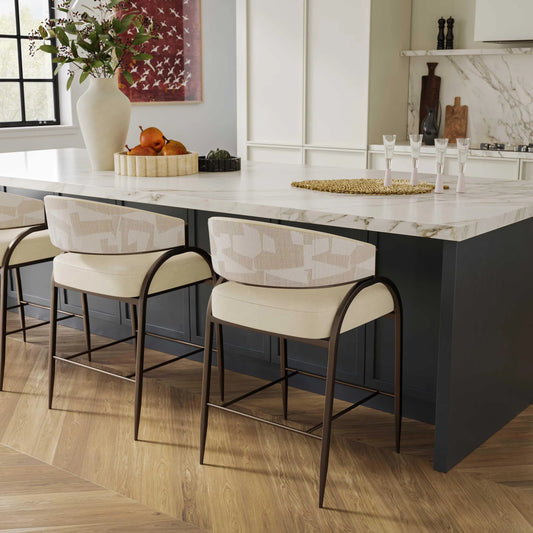 Tatum Vegan Leather and 2-Tone Jacquard Counter Stool by TOV Furniture in cream. Made from fabric, foam, plywood, polyester, stainless steel in a unique style.