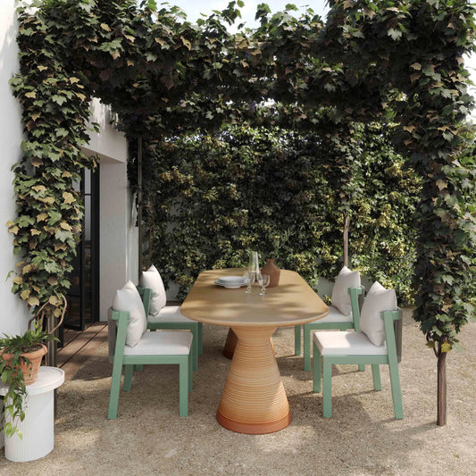 Fassa Oval Indoor/Outdoor Dining Table by TOV Furniture in terracotta. Made from concrete in a unique style.