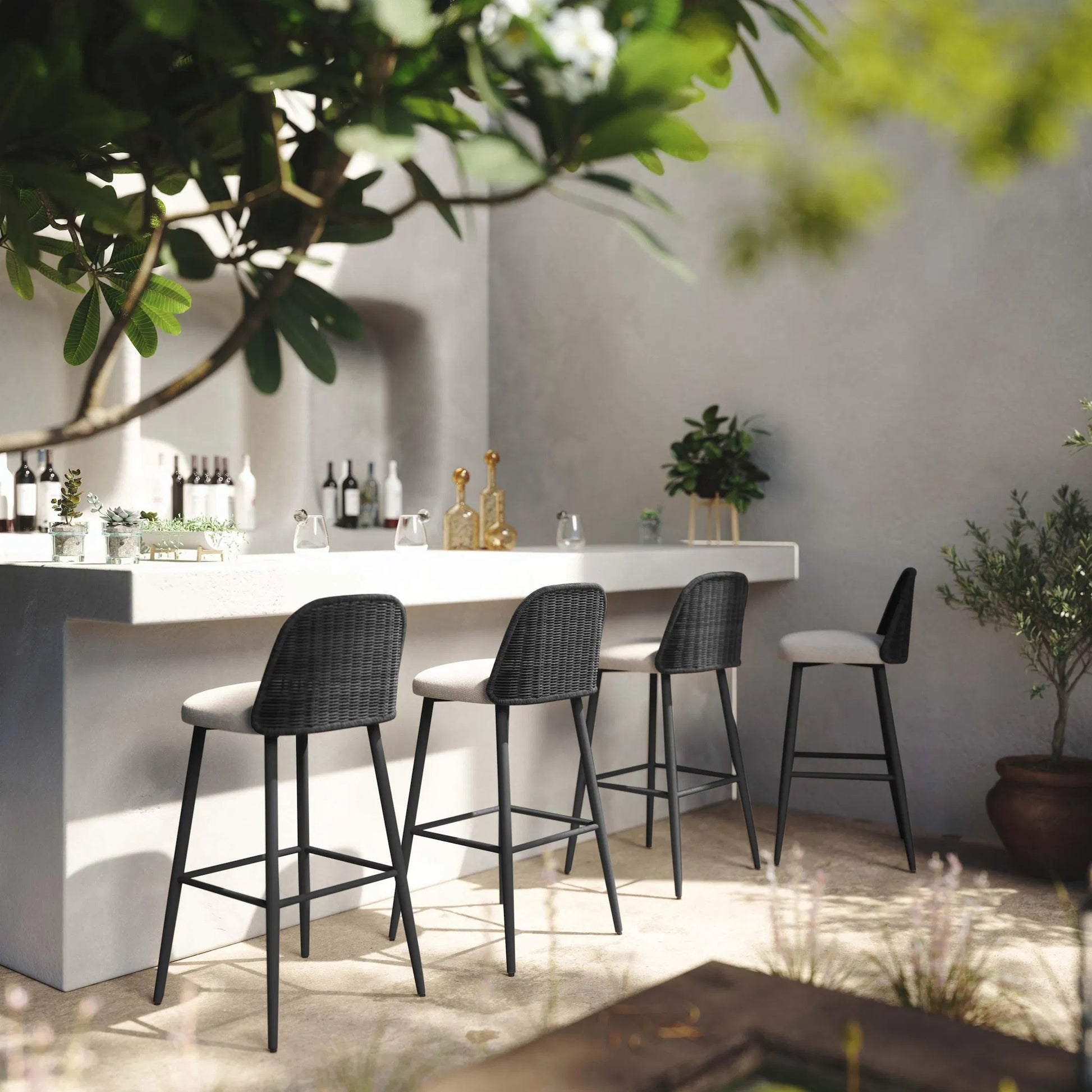 Alexa Performance Fabric Outdoor Bar Stool by TOV Furniture in black. Made from aluminum, polyester, wicker in a rustic style.