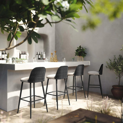 Alexa Performance Fabric Outdoor Bar Stool by TOV Furniture in black. Made from aluminum, polyester, wicker in a rustic style.