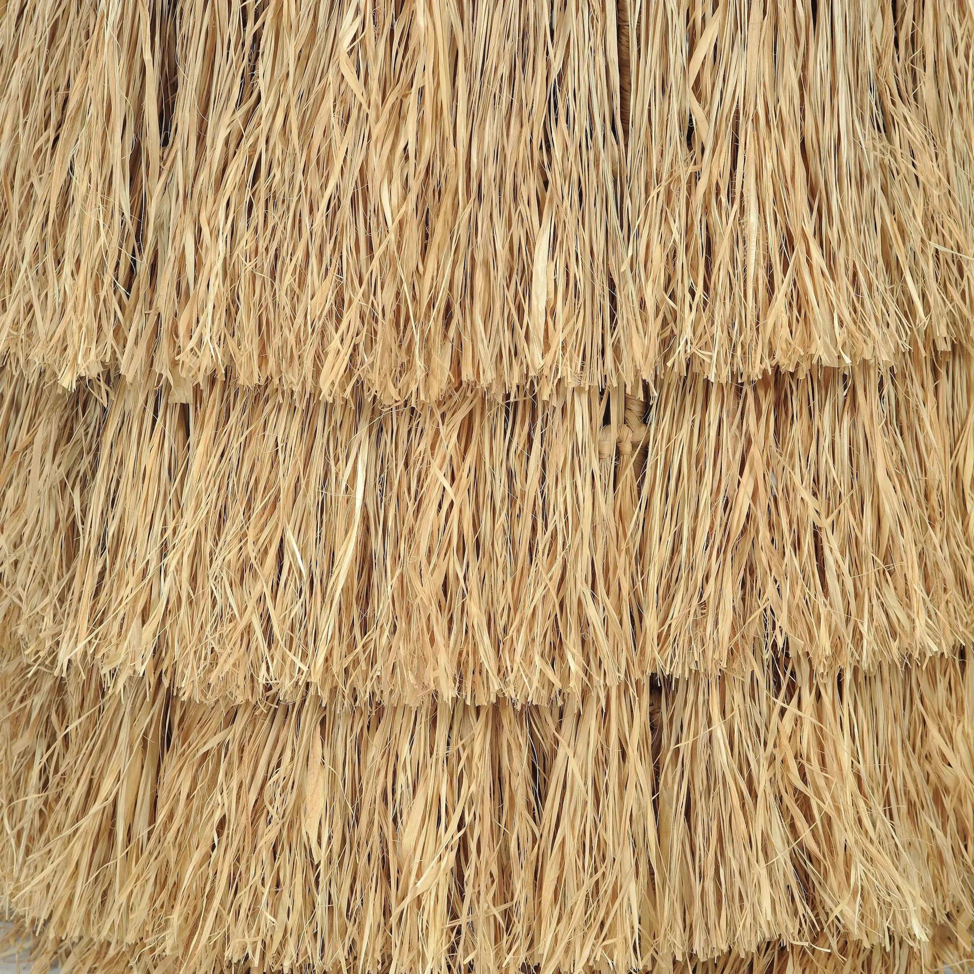 Luau Rattan Round End Table by TOV Furniture in natural. Made from rattan in a unique style.