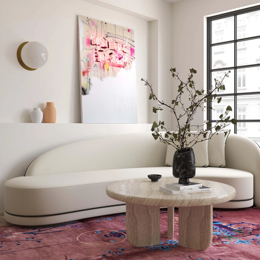 Patrizia Round Coffee Table by TOV Furniture in travertine. Made from concrete in a modern style.