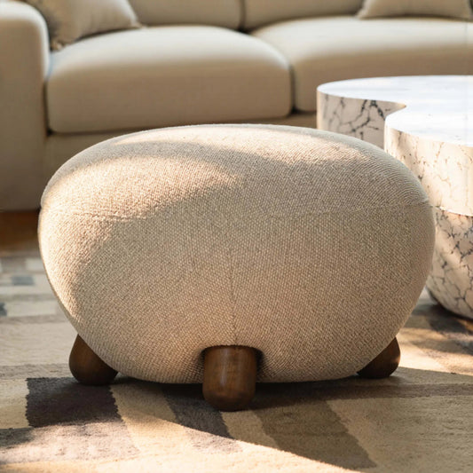 Pucker Ottoman by TOV Furniture in warm grey. Made from boucle, plywood, rubberwood in a transitional style.