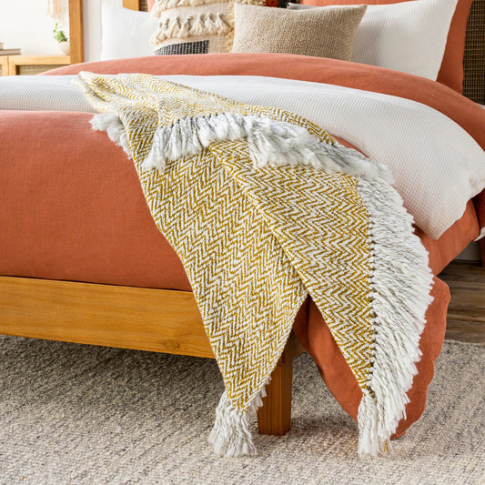 Trina - 14396 by Surya in gold, ivory, charcoal. Made from 90% acrylic, 10% polyester in a traditional style.