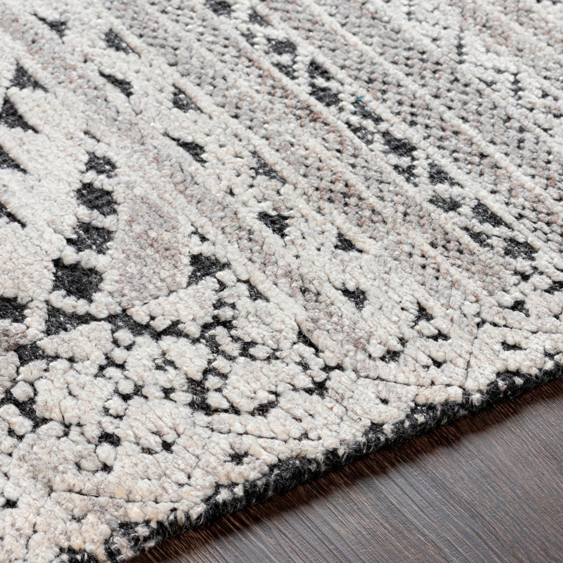 Tunus TUN-2304 Indoor/Outdoor Rug by Surya in black, off-white, charcoal. Made from 70% new zealand wool, 30% viscose in a unique style.