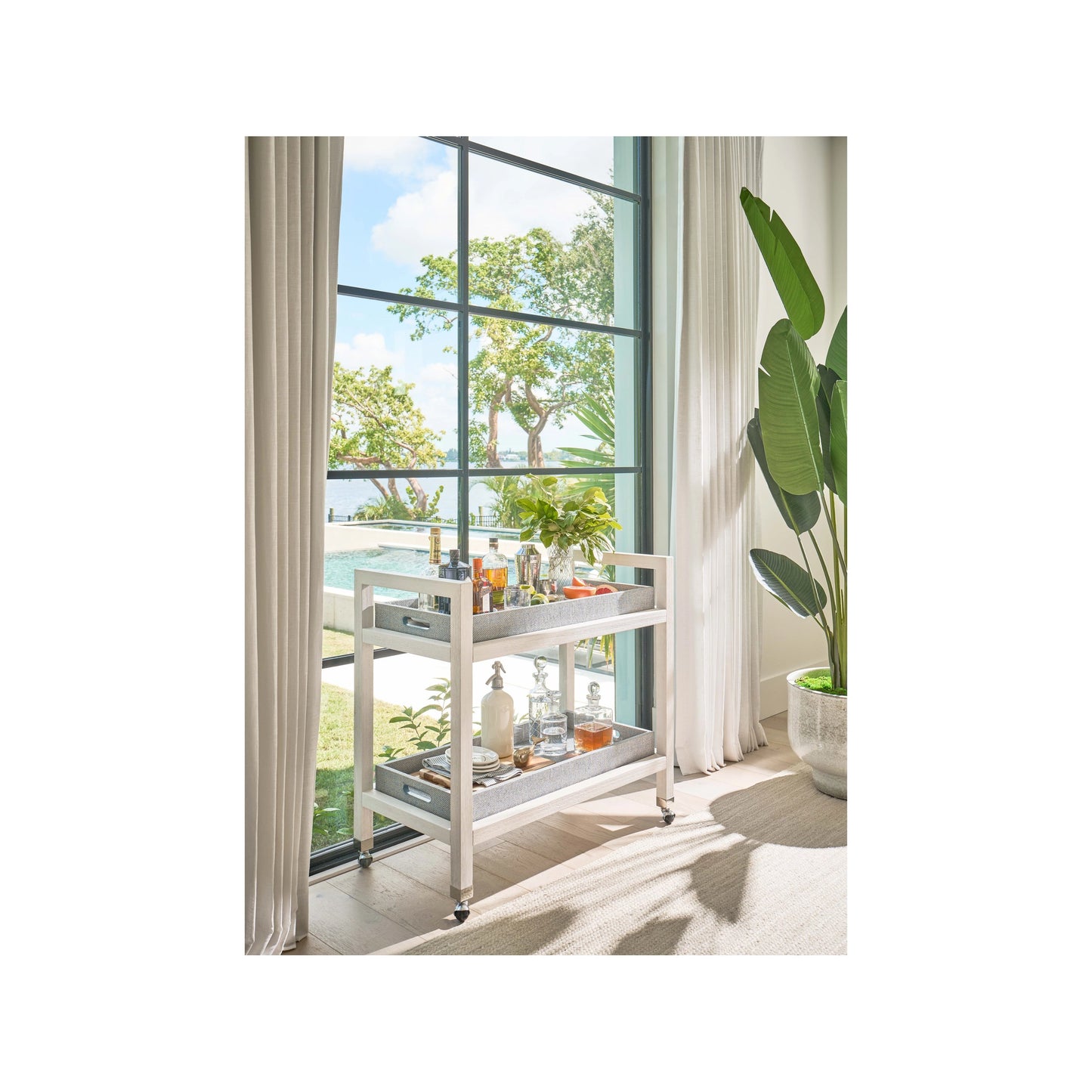 003 SI-2130241 | Lifestyle | Weekender Jupiter Bar Cart by Coastal Living by Universal Furniture in white sand, blue seagrass. Made from unique in a modern style.