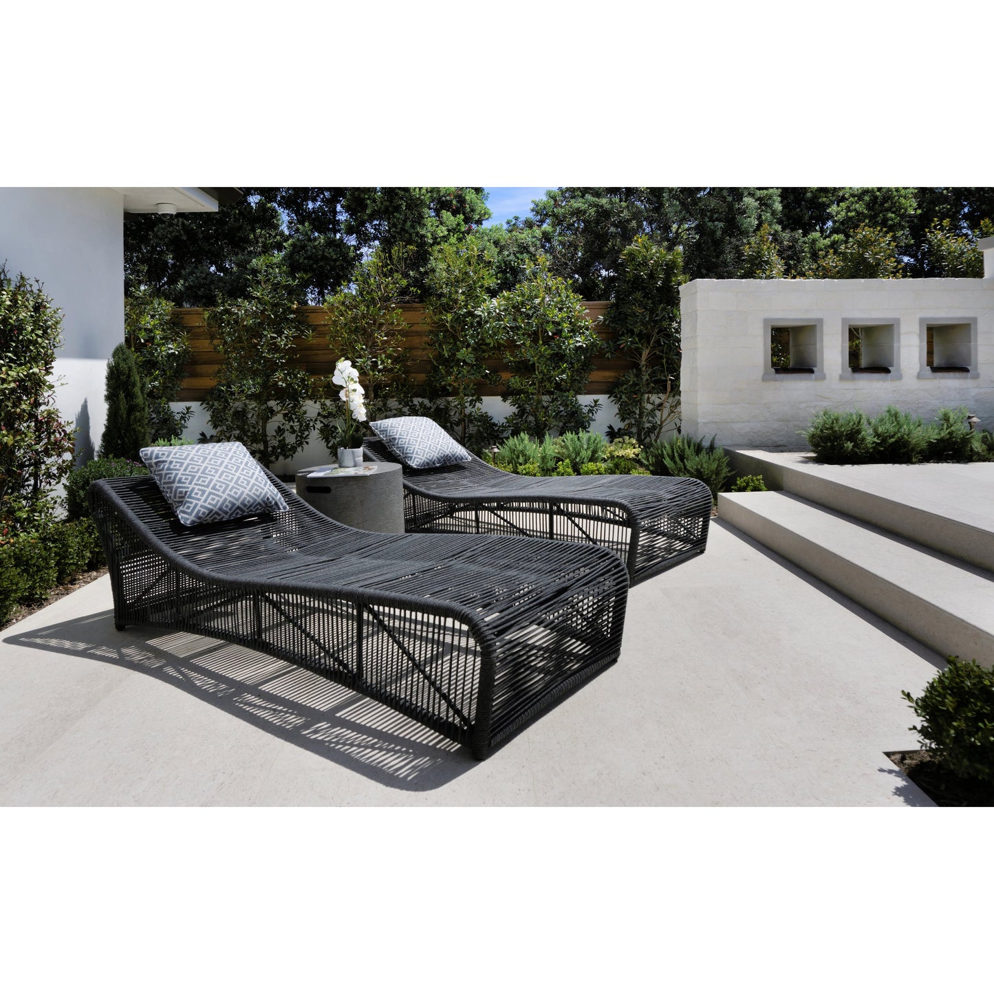 004 SI-2167040 | Lifestyle | Milano Outdoor Cushionless Chaise by Sunset West in slate. Made from olefin rope in a coastal style.