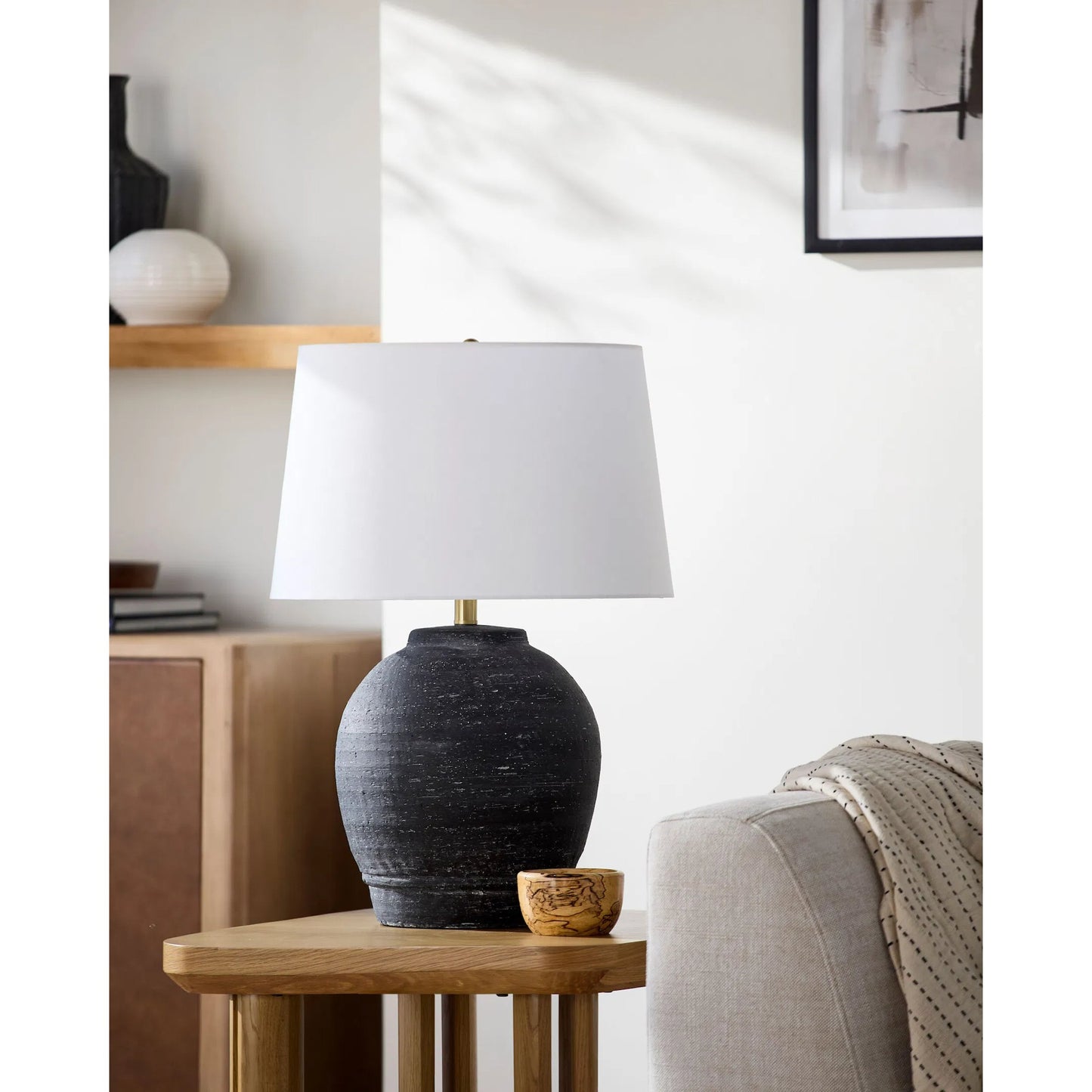 002 SI-2459591 | Lifestyle | Uluru Accent Table Lamp by Surya in white, black, metallic gold, translucent. Made from ceramic, linen, polyester, iron in a modern style.