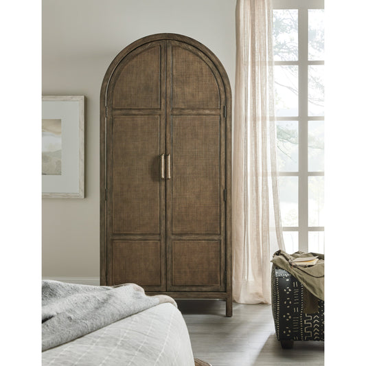 Sundance Wardrobe by Hooker Furniture in cliffside. Made from pecan veneers, rattan, self-closing undermount drawer guides in a traditional style.