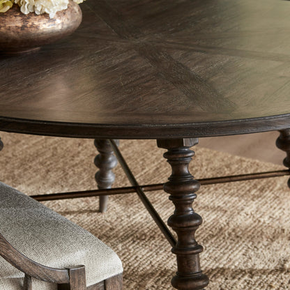 Revival Row Round Table by Pulaski Furniture in chimney smoke. Made from rubberwood in a traditional style.