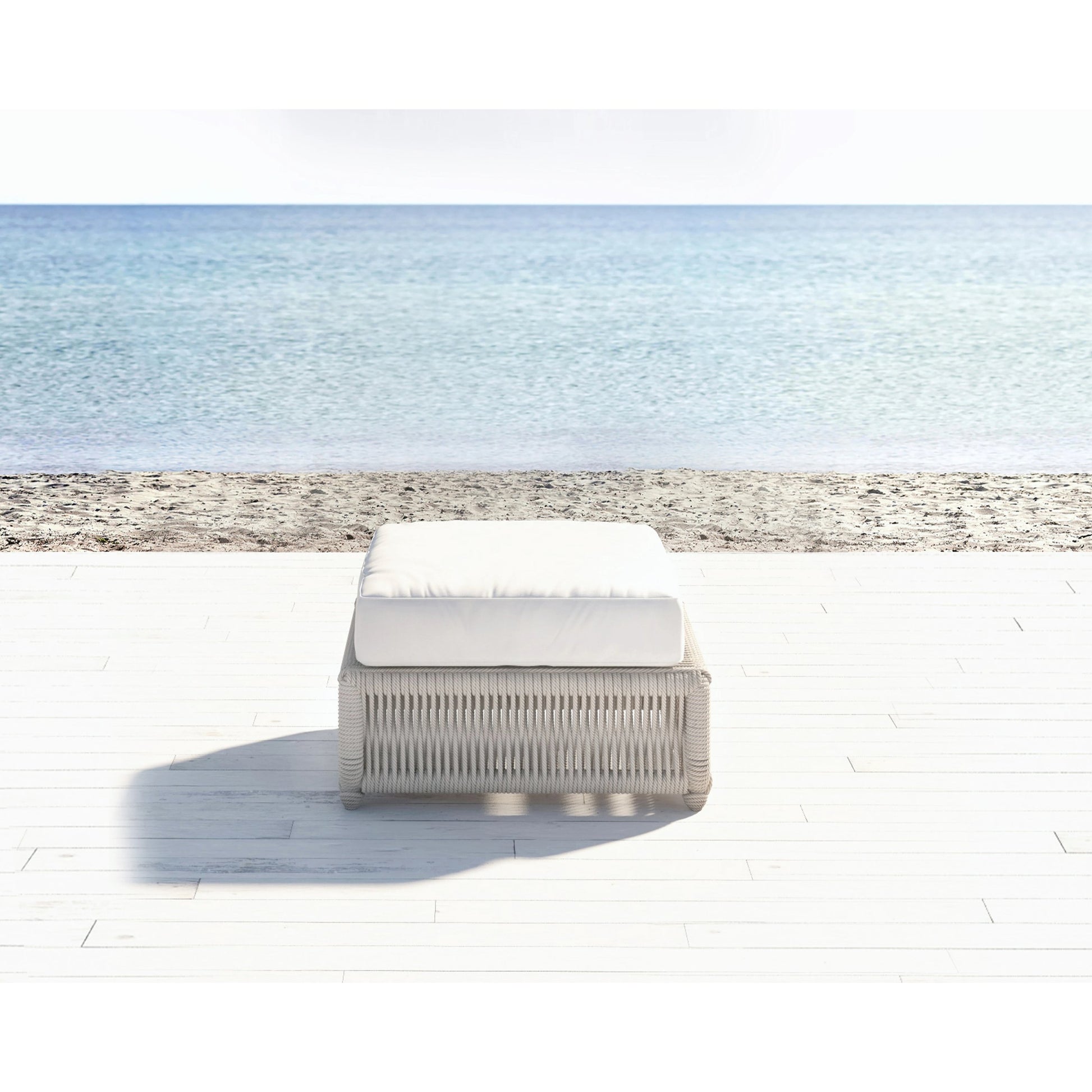 Dana Outdoor Rope Ottoman in Linen by Sunset West in natural. Made from olefin rope in a coastal style.