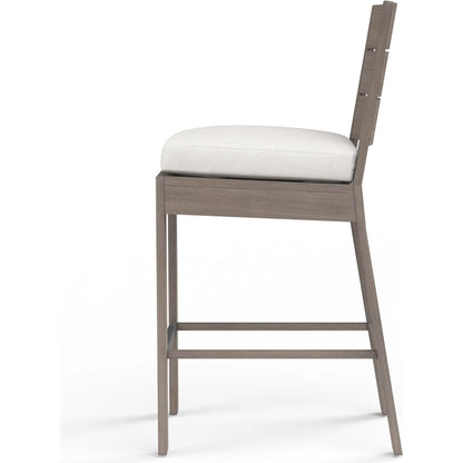 Laguna Outdoor Barstool in Canvas Flax by Sunset West in driftwood. Made from aluminum in a modern style.