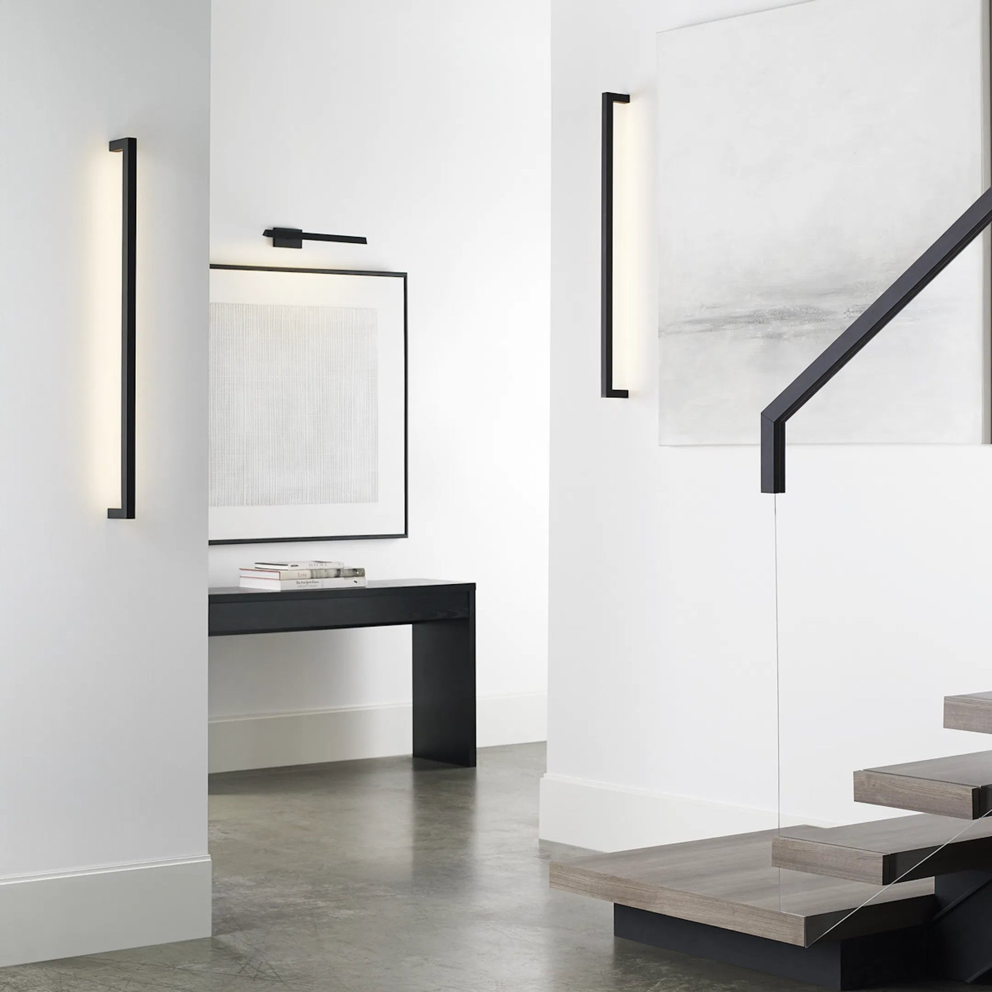 Stagger Medium Wall Sconce by Visual Comfort & Co.. Made from aluminum or brass in a unique style.
