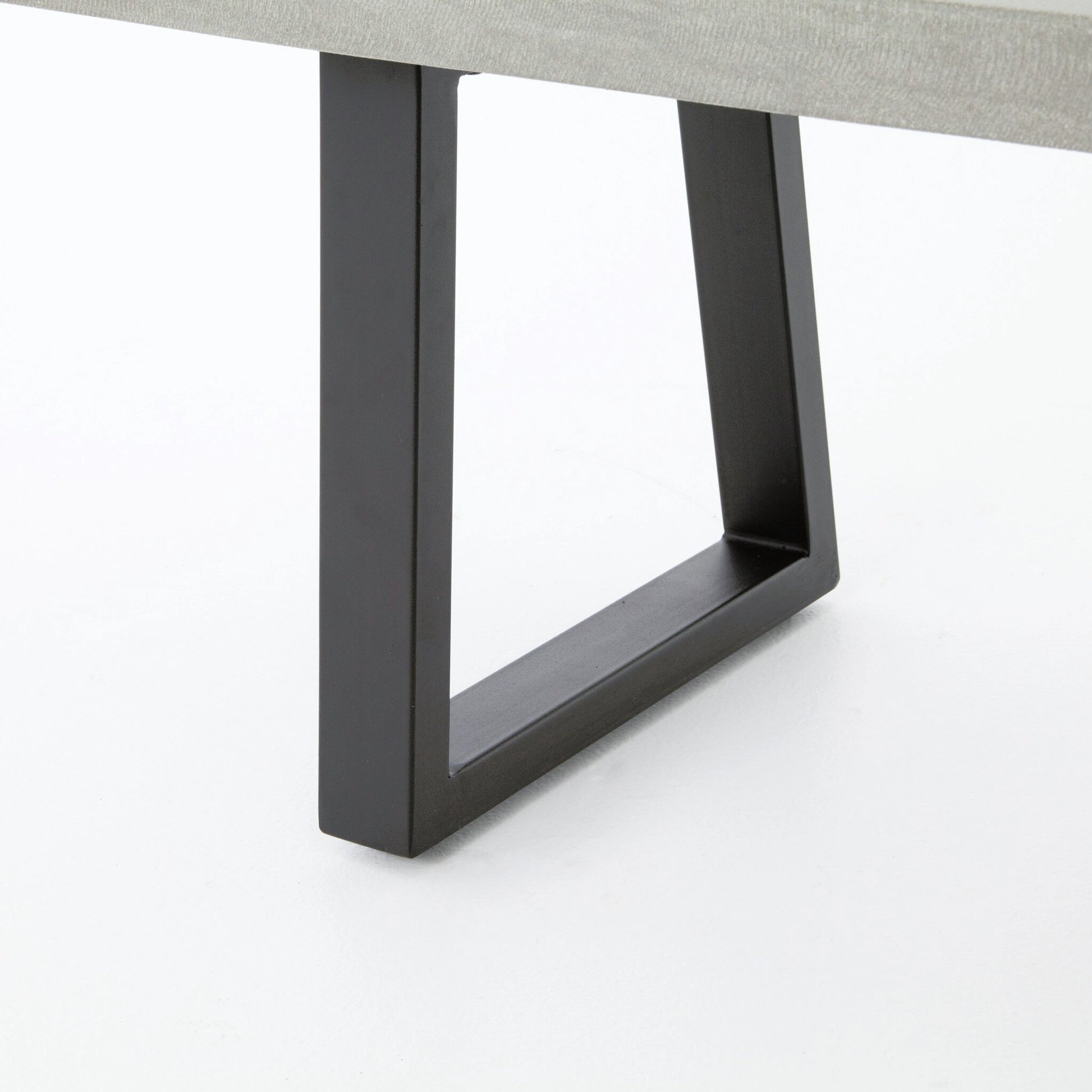 Cyrus Dining Bench by Four Hands in black and grey. Made from lavastone composite, iron in a modern style.