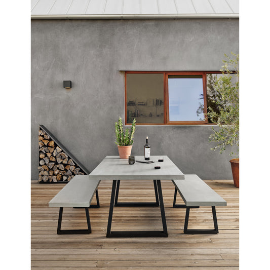 Cyrus Dining Bench by Four Hands in black and grey. Made from lavastone composite, iron in a modern style.