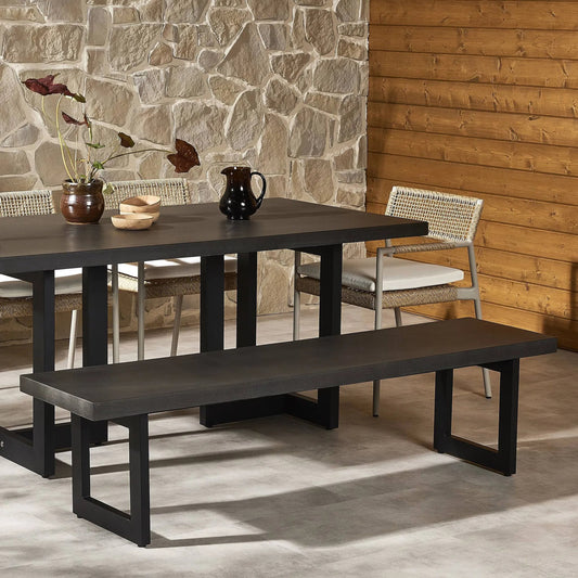Judith Outdoor Dining Bench by Four Hands in black, black lavastone. Made from lavastone composite, iron in a modern style.
