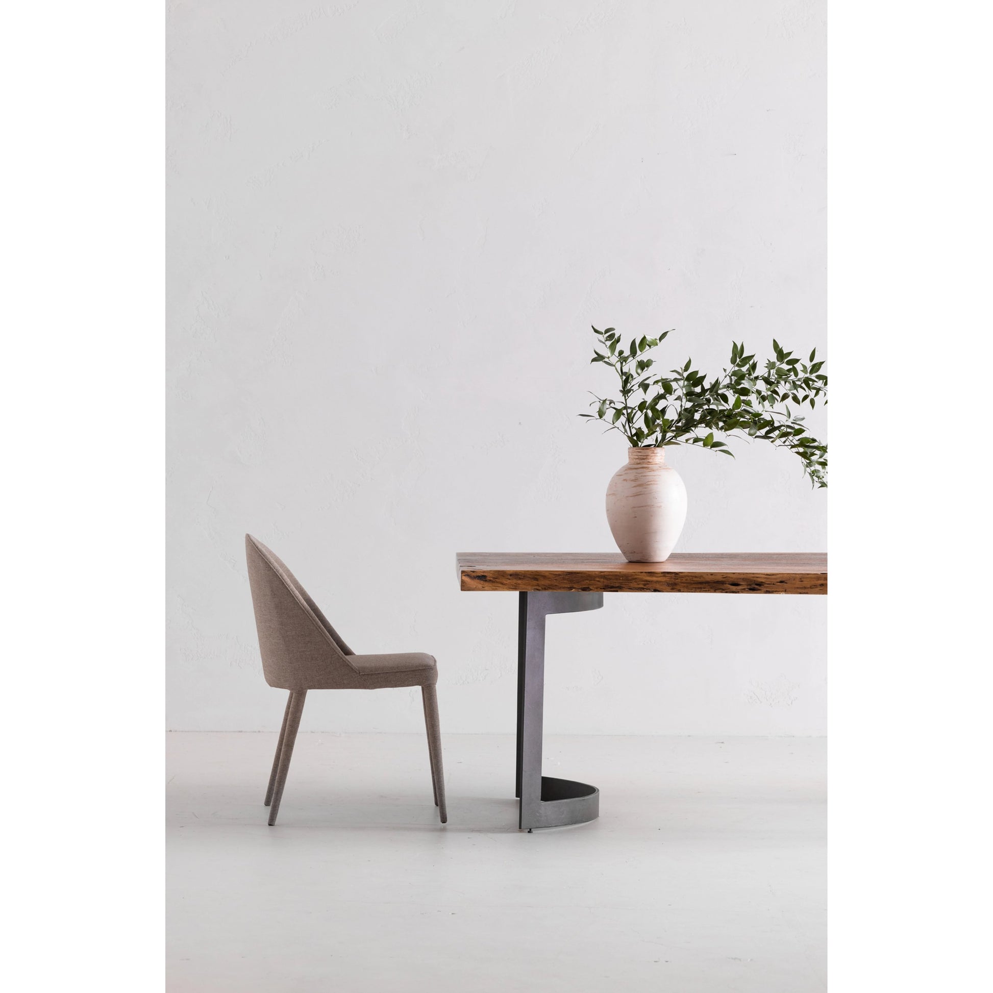 Bent Dining Table by Moe's Home Collection in brown. Made from solid acacia, iron base in a modern style.