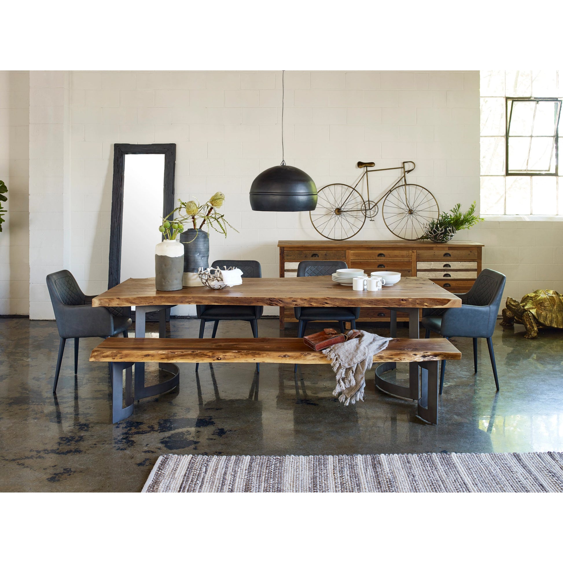 Bent Dining Table by Moe's Home Collection in brown. Made from solid acacia, iron base in a modern style.