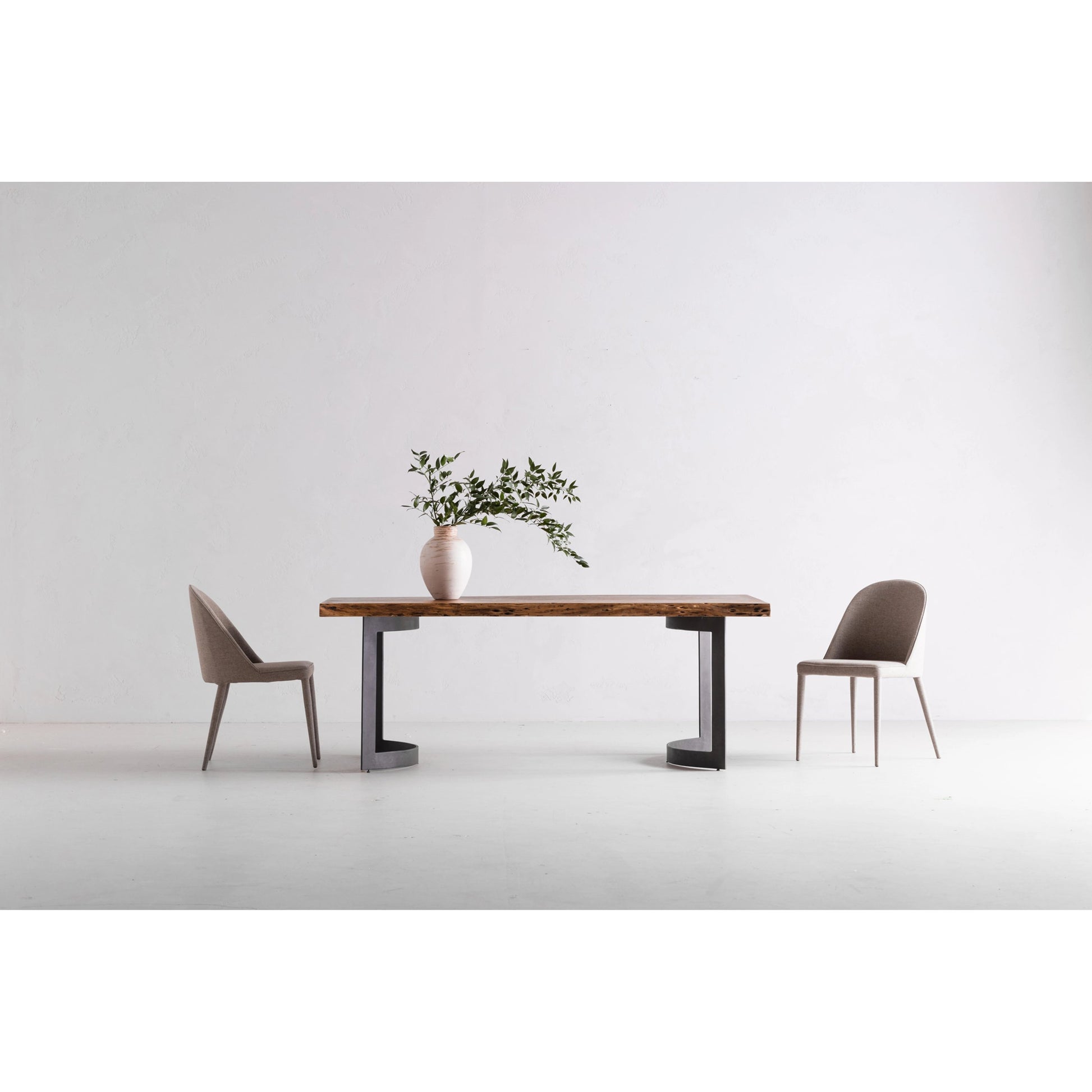 Bent Dining Table by Moe's Home Collection in brown. Made from solid acacia, iron base in a modern style.