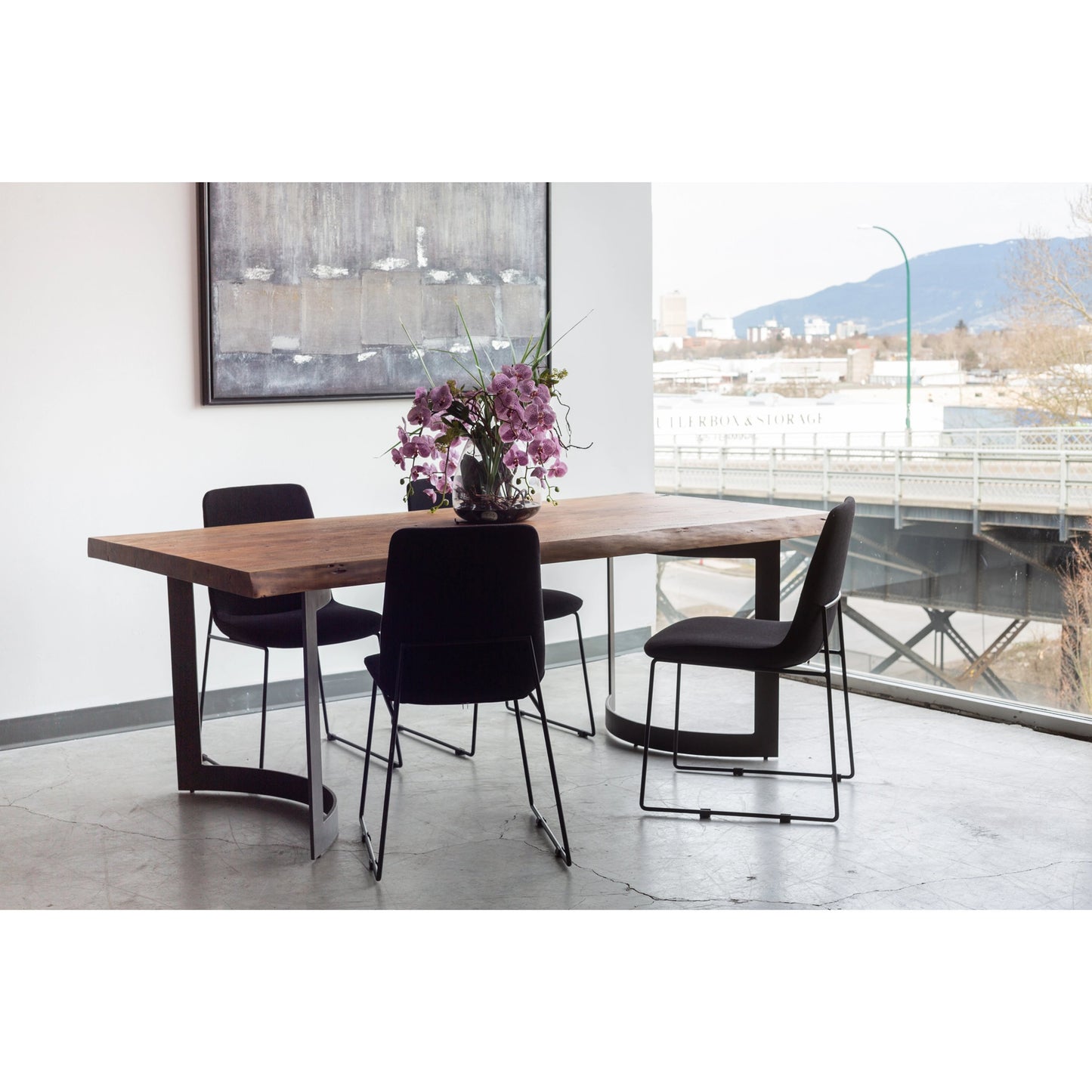 055 SI-2121872 | Lifestyle | Bent Dining Table by Moe's Home Collection in brown. Made from solid acacia, iron base in a modern style.