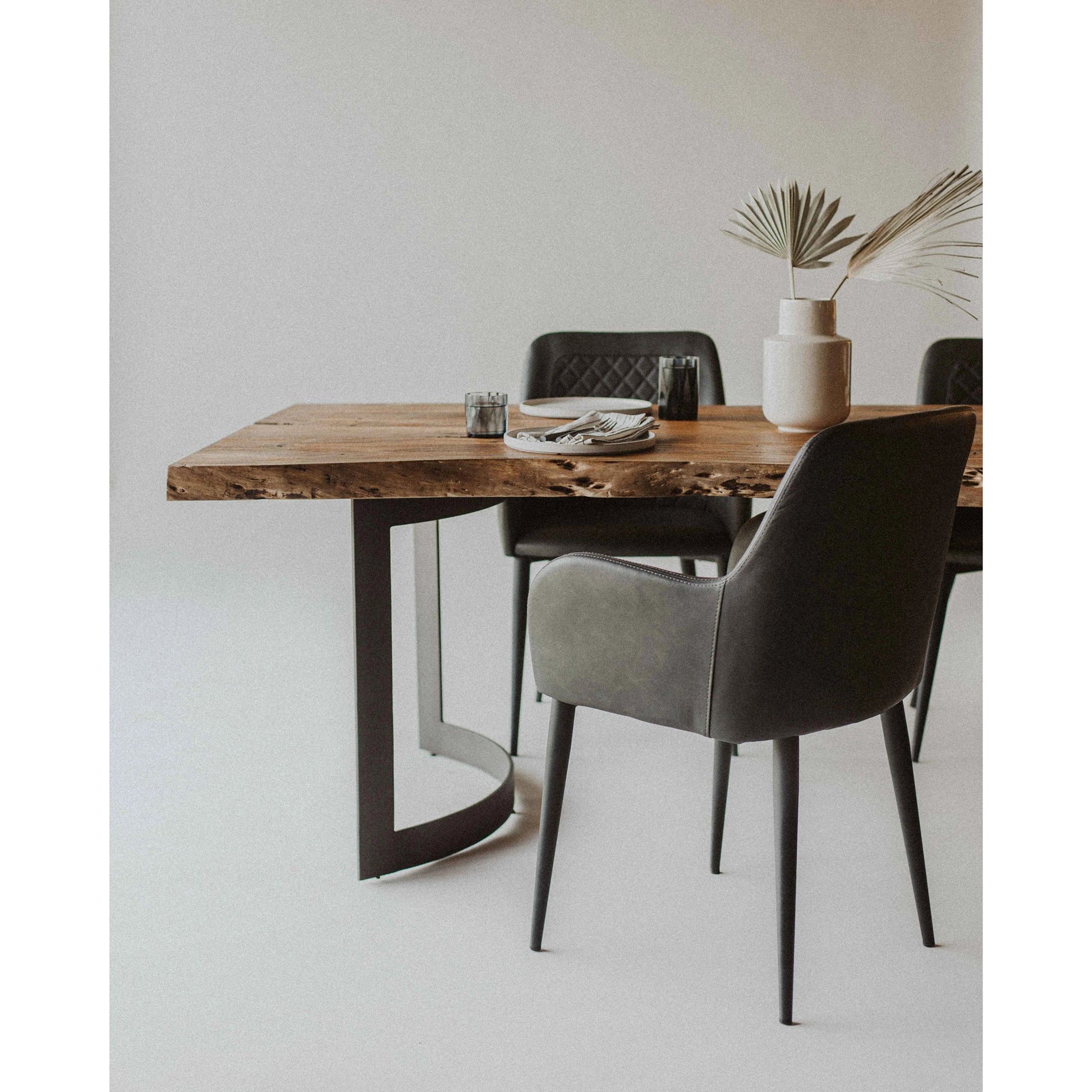 Bent Dining Table by Moe's Home Collection in brown. Made from solid acacia, iron base in a modern style.