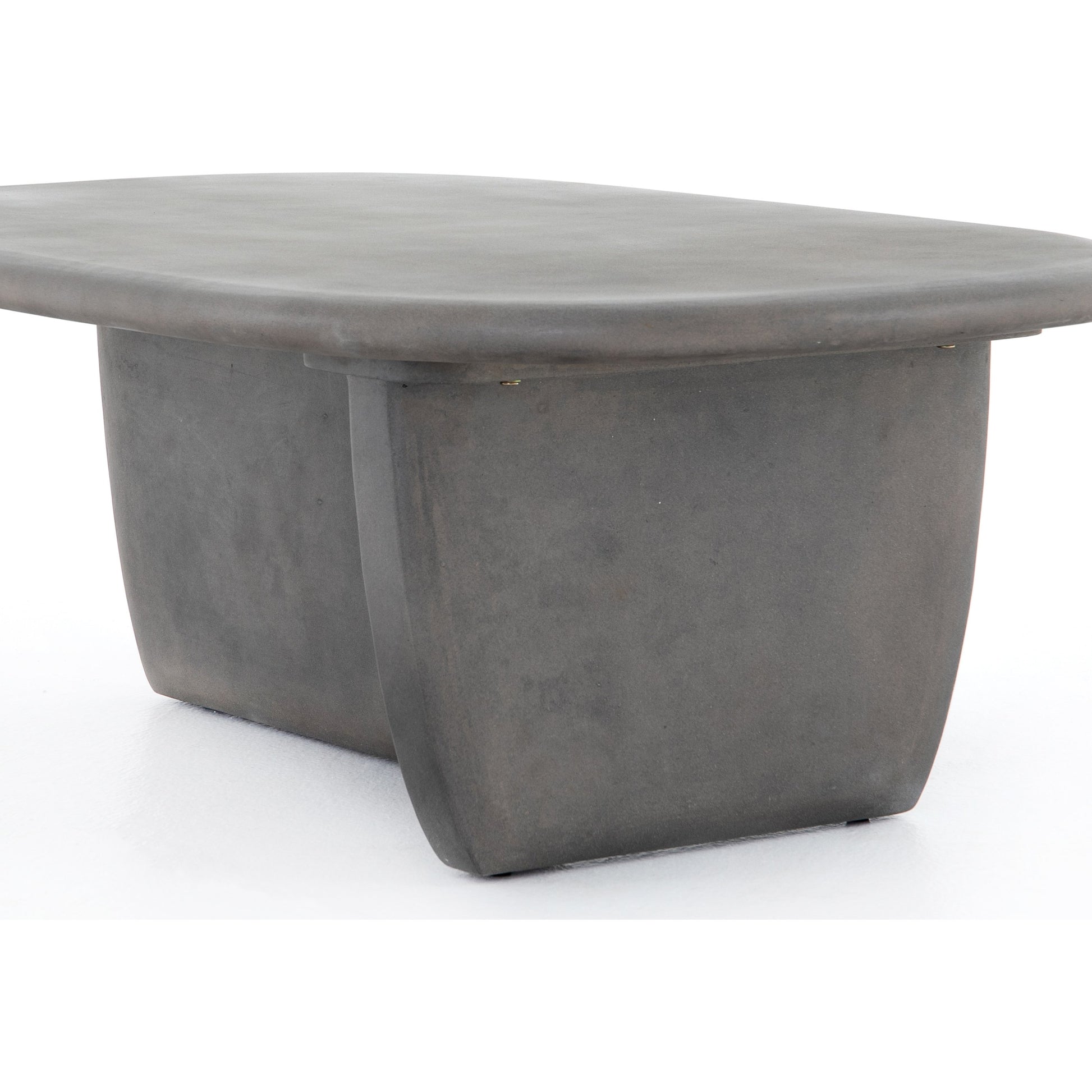 Naya Outdoor Coffee Table by Four Hands in dark grey and dark gray. Made from concrete in a modern style.