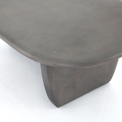 Naya Outdoor Coffee Table by Four Hands in dark grey and dark gray. Made from concrete in a modern style.