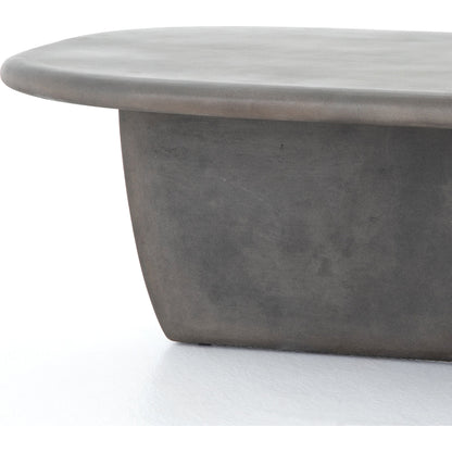 Naya Outdoor Coffee Table by Four Hands in dark grey and dark gray. Made from concrete in a modern style.