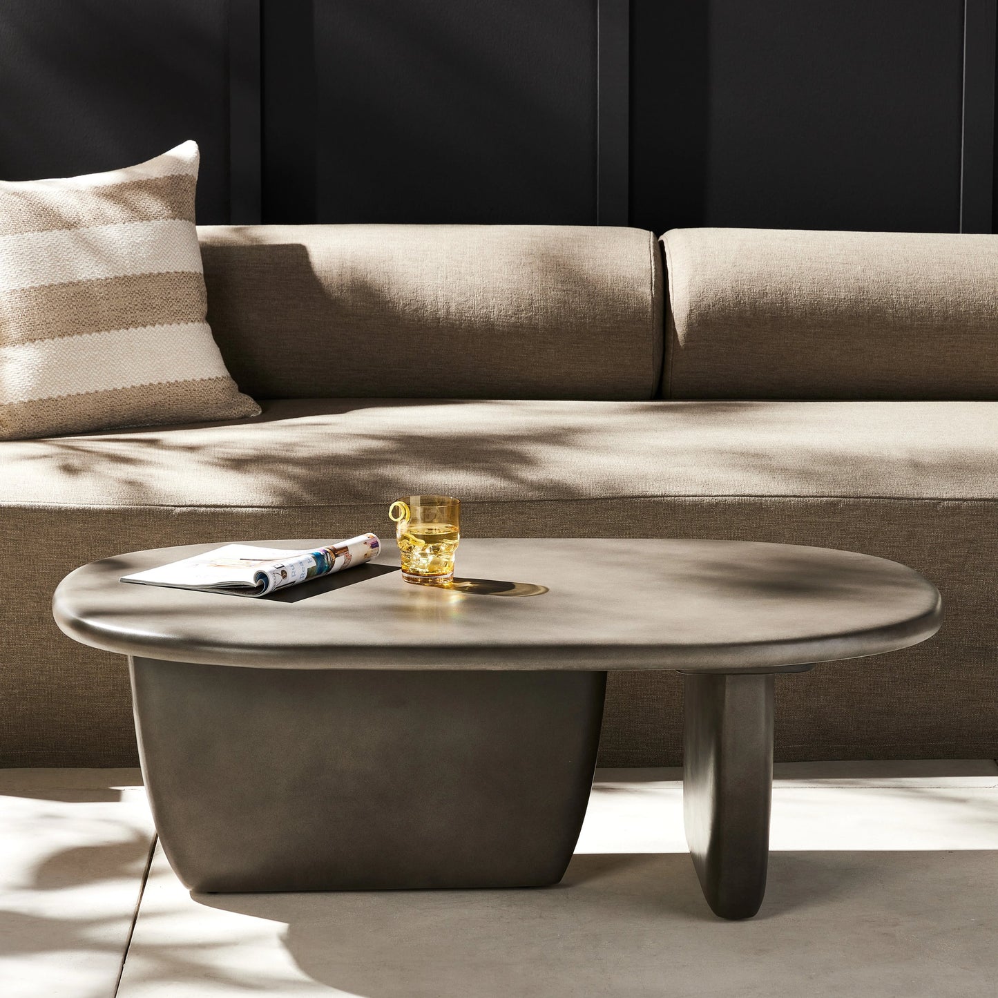 010 SI-1716213 | Lifestyle | Naya Outdoor Coffee Table by Four Hands in dark grey and dark gray. Made from concrete in a modern style.