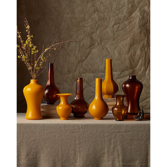 Gold Peking Stem Vase by Currey and Company in amber. Made from glass in a modern style.