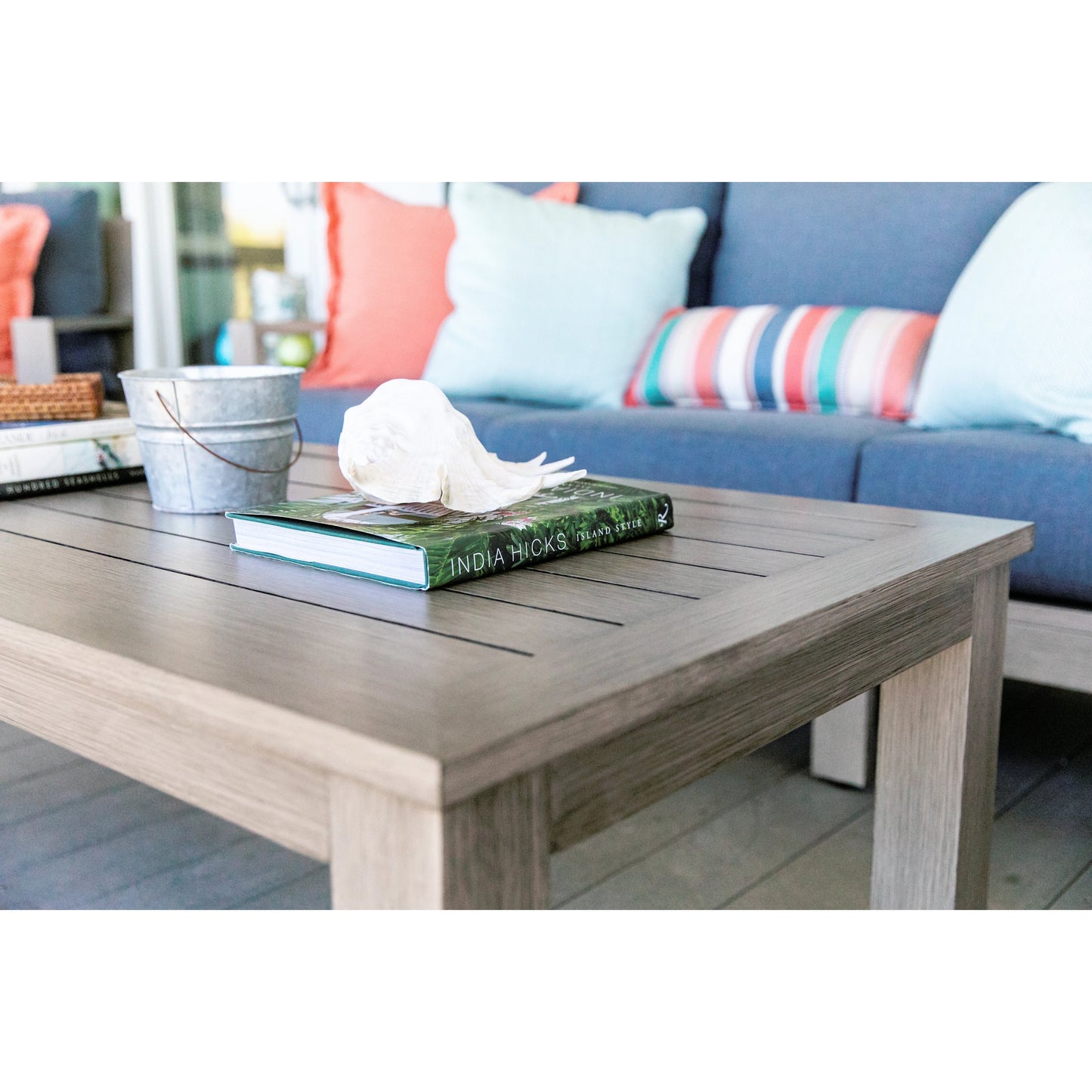 007 SI-2166958 | Lifestyle | Laguna Outdoor Coffee Table by Sunset West in driftwood. Made from aluminum in a modern style.