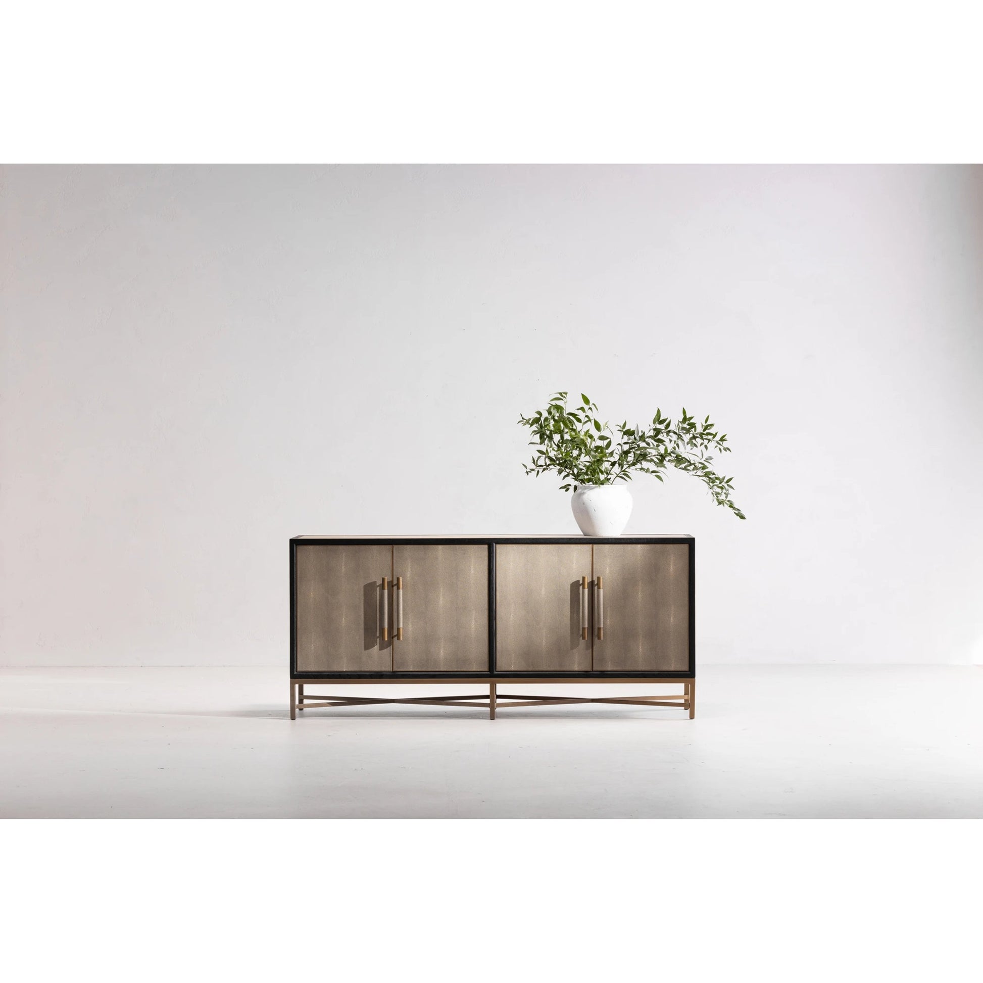 Mako Sideboard by Moe's Home Collection. Made from shagreen patterned polyurethane, solid black oak frame, brass legs, plywood on door, side panel, top panel back panel in a modern style.