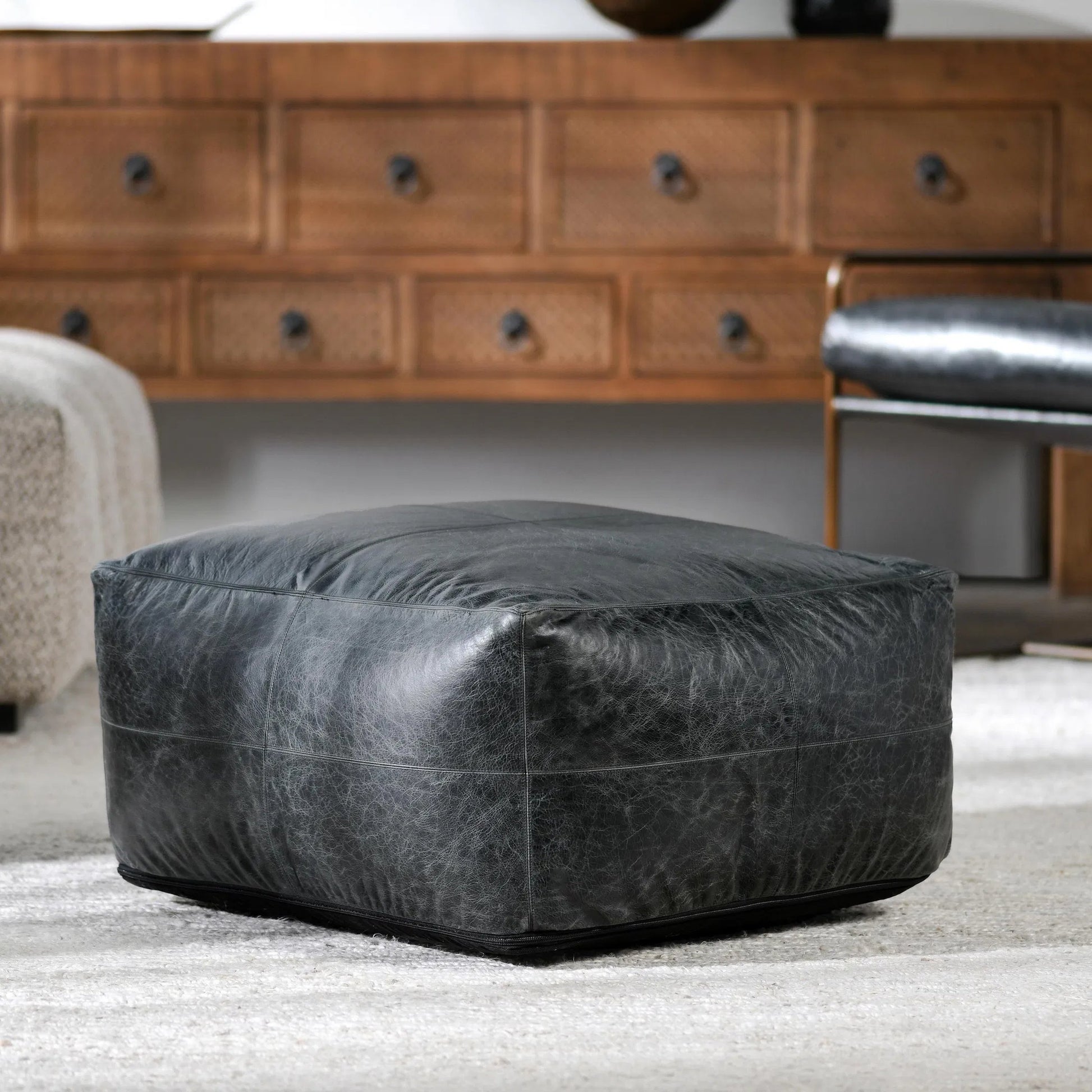Dexter Genuine Leather Pouf by Villa by Classic Home in black. Made from 100% genuine leather in a traditional style.