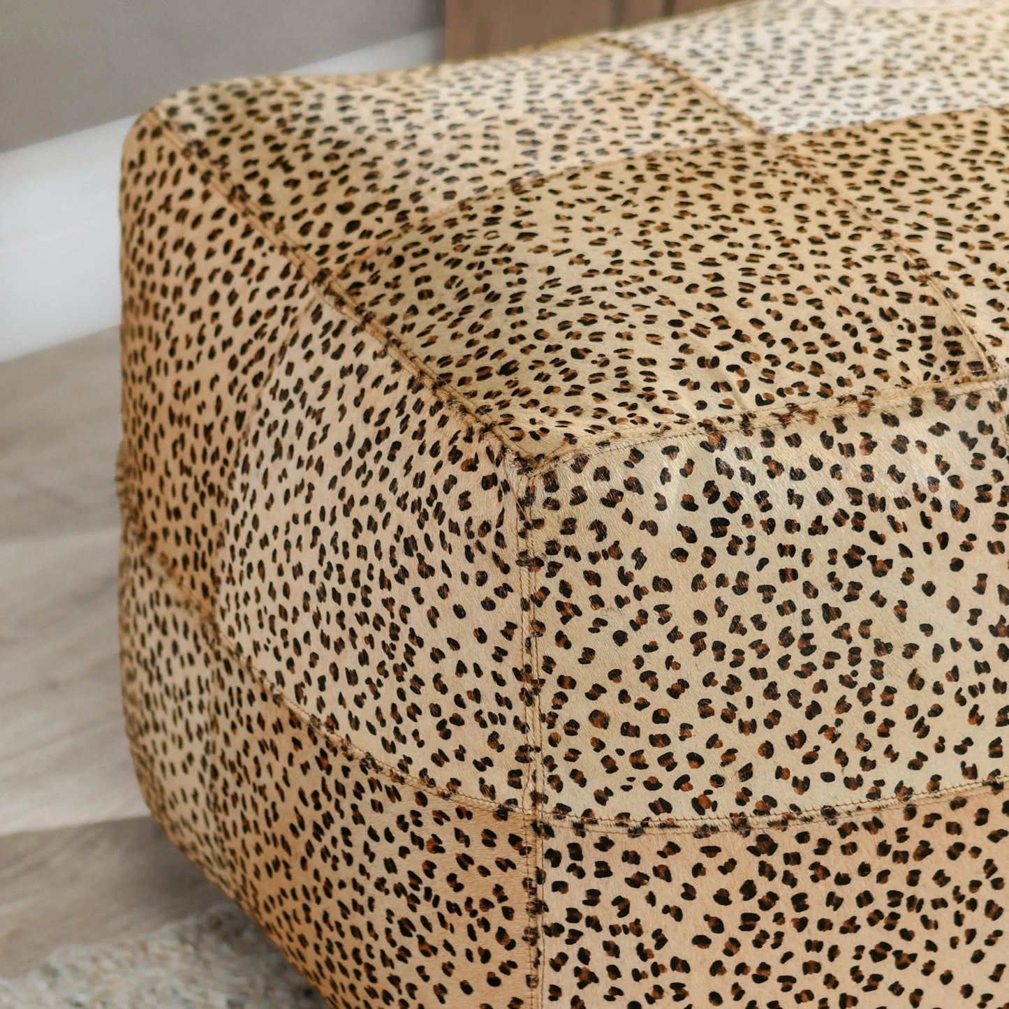 003 SI-2243878 | Closeup | Leopard  Camel Floor Cushion Pouf by Villa by Classic Home in camel, black. Made from 100% cow hide in a eclectic & global style.