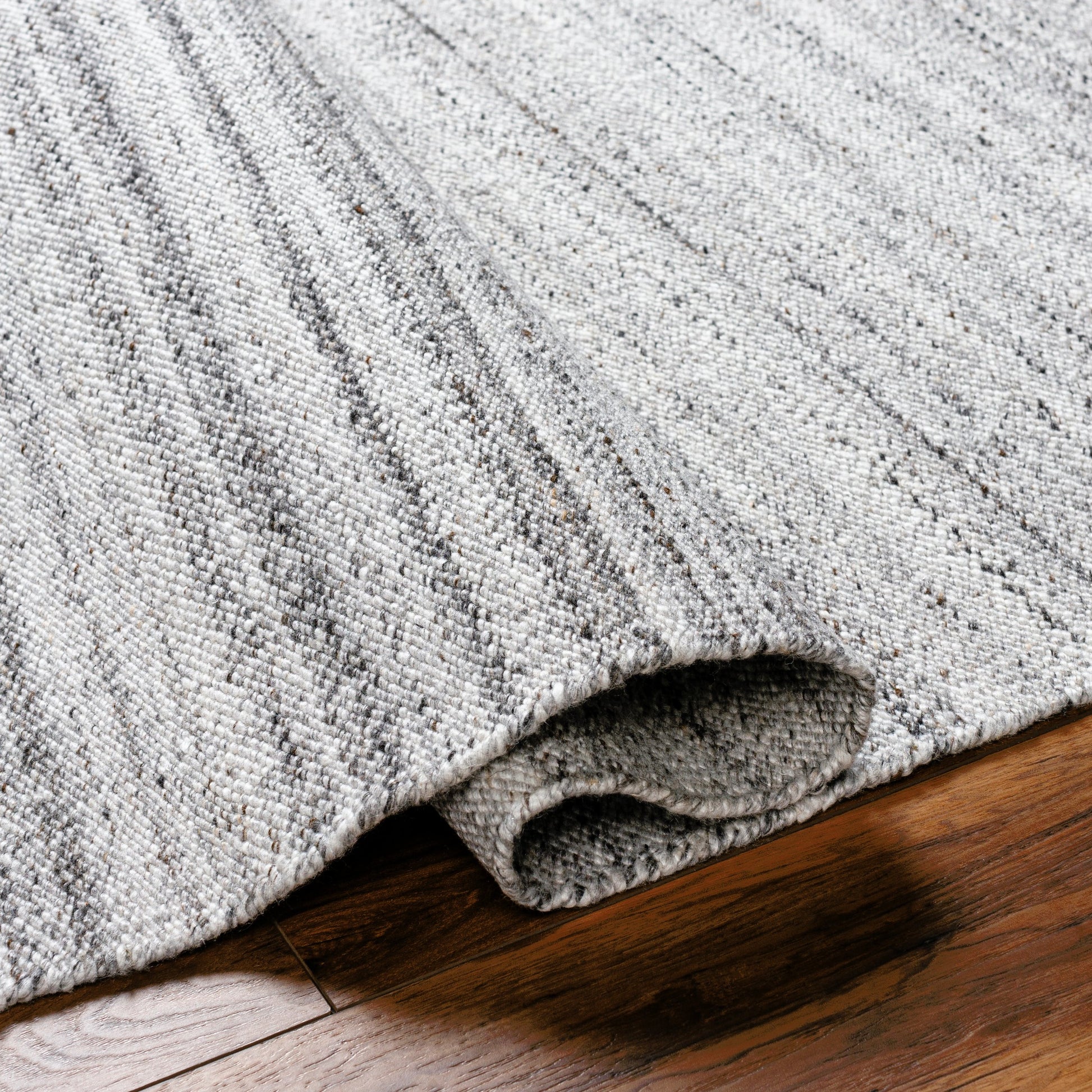 Verna VRA-2302 Indoor/Outdoor Rug by Surya in cream, light gray, medium gray, taupe, black. Made from 100% recycled pet yarn in a unique style.