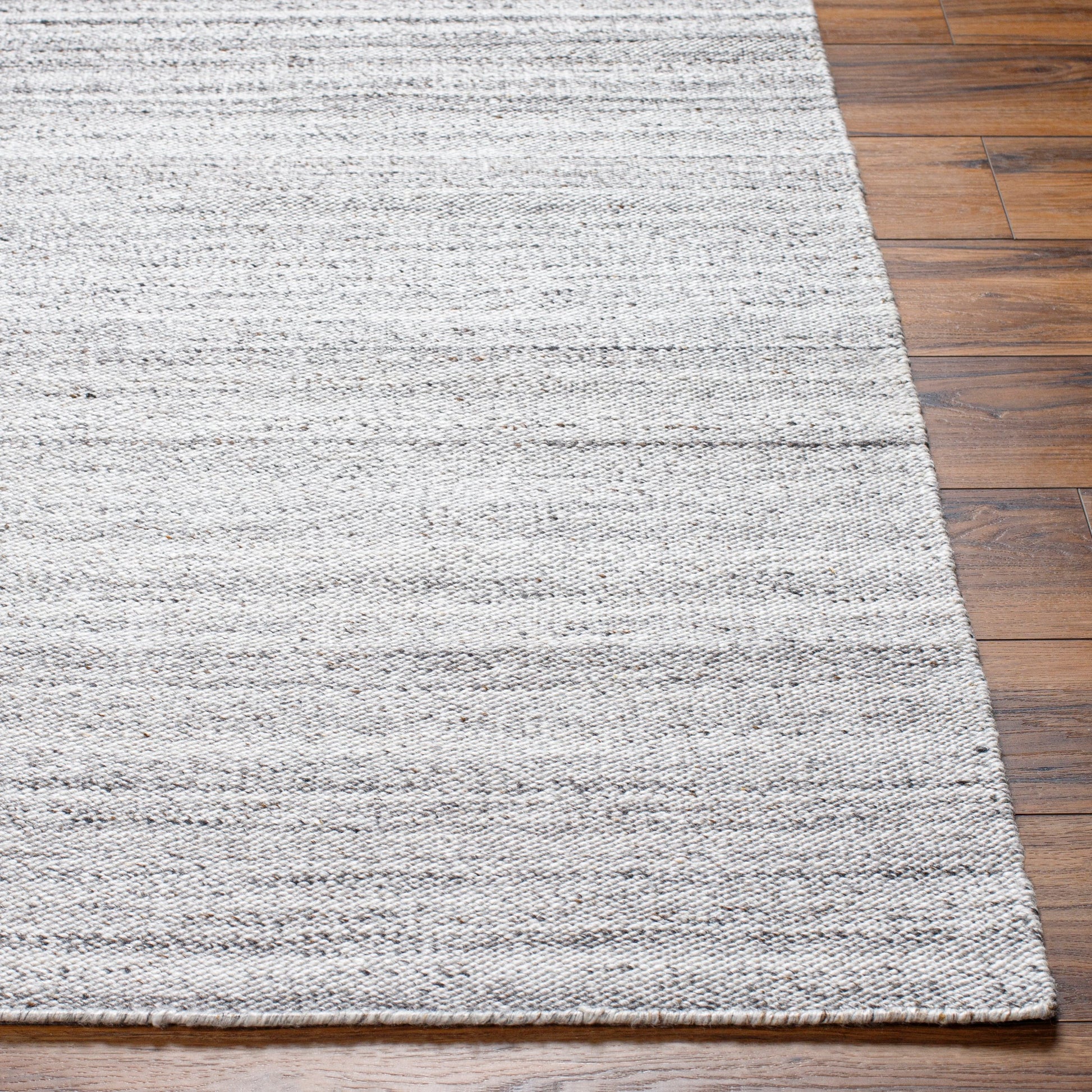 Verna VRA-2302 Indoor/Outdoor Rug by Surya in cream, light gray, medium gray, taupe, black. Made from 100% recycled pet yarn in a unique style.