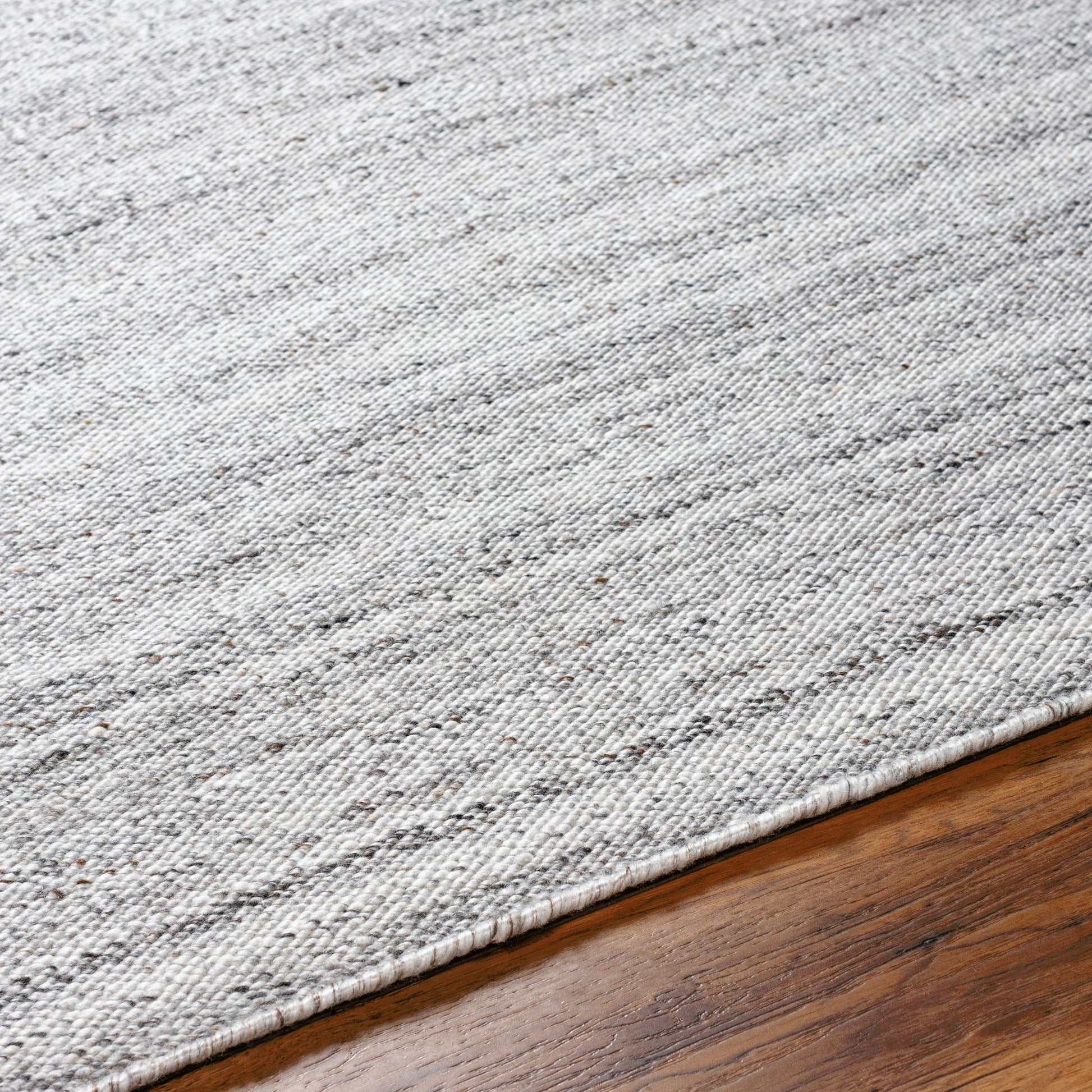 Verna VRA-2302 Indoor/Outdoor Rug by Surya in cream, light gray, medium gray, taupe, black. Made from 100% recycled pet yarn in a unique style.
