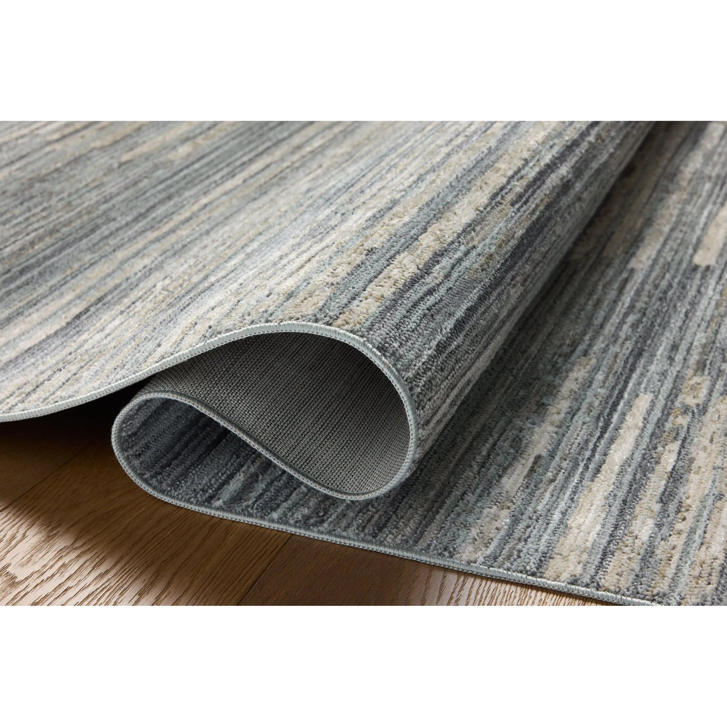 004 SI-2160077,SI-2160078,SI-2160079,SI-2160080,SI-2160081,SI-2160082,SI-2160083,SI-2160084,SI-2160085,SI-2160086 | Closeup | Wade WAE-02 Rug by Loloi in ocean, sand. Made from 100% polyester in a unique style.