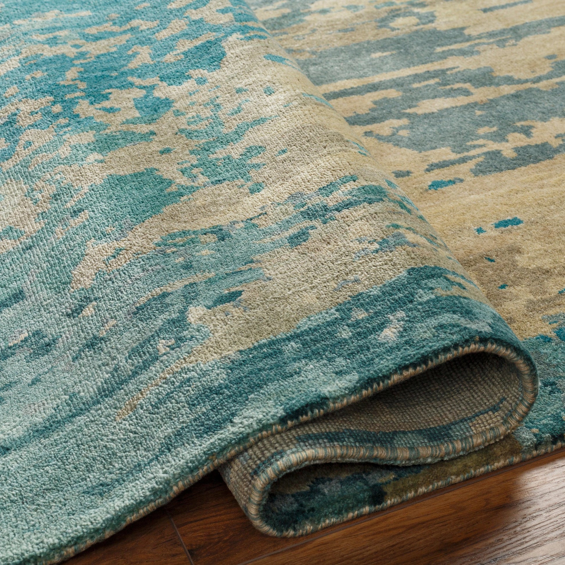Watercolor Rug - 21179 by Surya in teal, light sage, light gray, taupe, medium gray, sky blue. Made from 100% wool in a unique style.