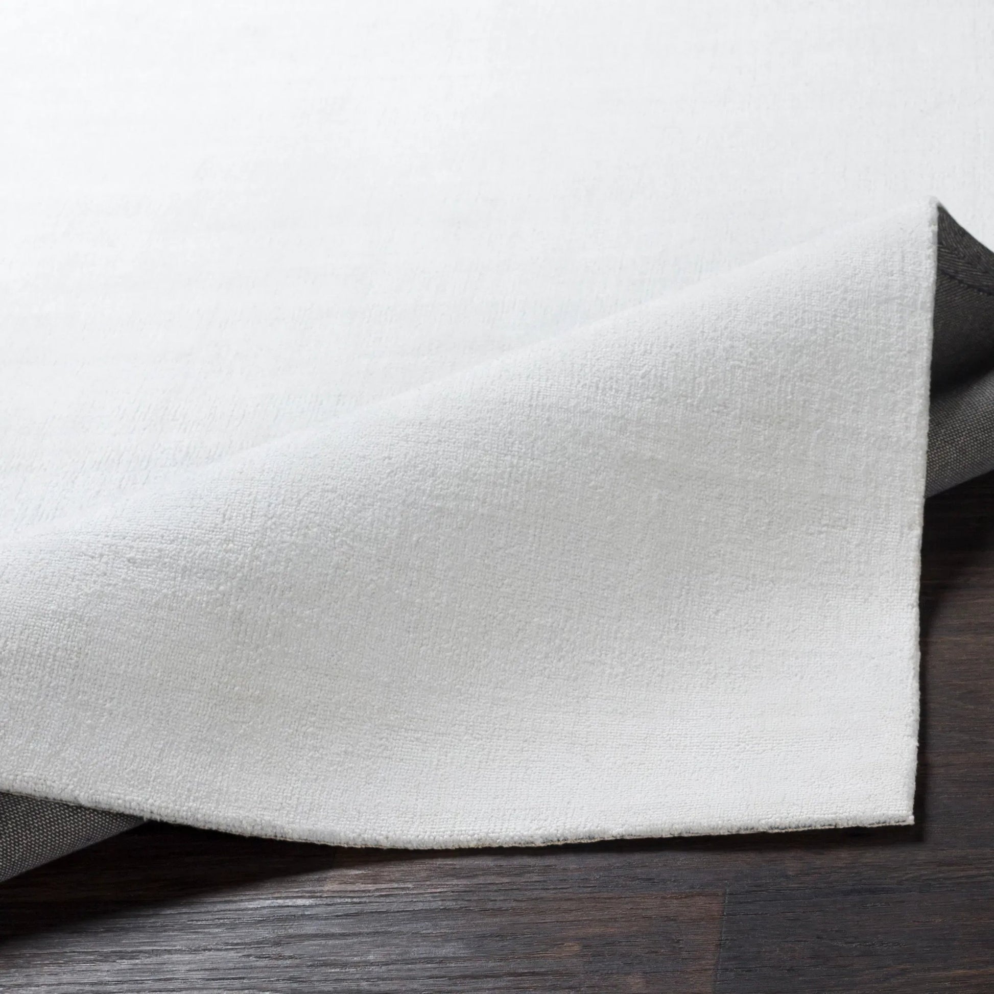 Wilkinson Rug by Livabliss in white. Made from face: 100% polyester, warp: 100% cotton in a coastal style.