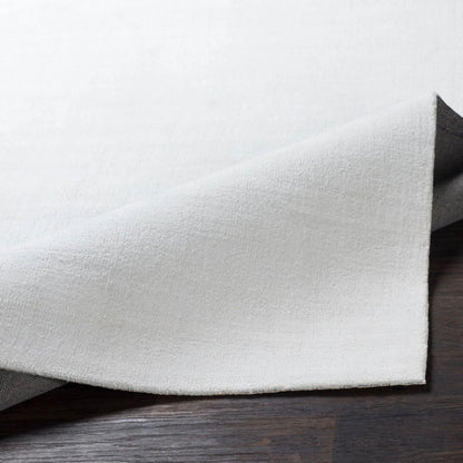 Wilkinson Rug by Livabliss in white. Made from face: 100% polyester, warp: 100% cotton in a coastal style.